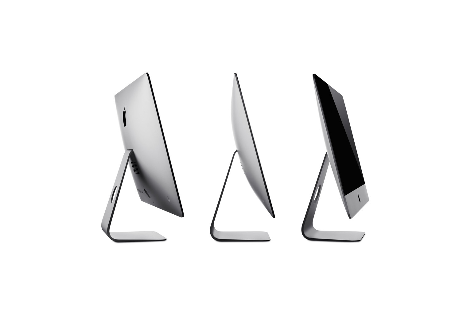 Photo by Samuel Galanský: Side view of three silver Apple iMac computers arranged in a row on a white background.